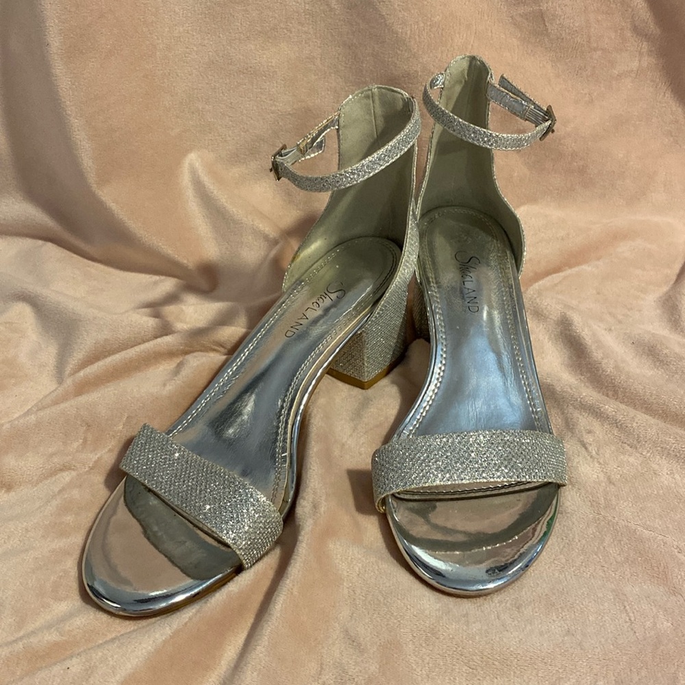 Glittery, silver shoes with a chunky heel, and straps. Size 7 1/2, worn once